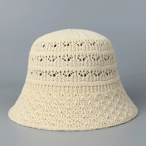 Detailed close-up of the beige crochet hollow texture on this stylish summer bucket hat