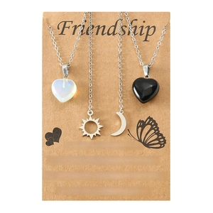 Friendship set of four necklaces with sun, moon, and heart stone pendants on card