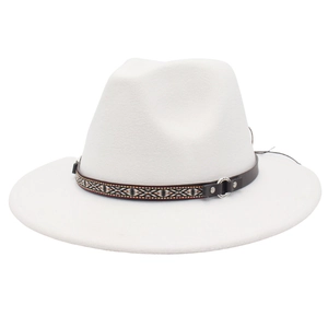 Detail of white felt fedora hat featuring an ethnic geometric band and metal buckle
