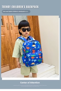 Detail of dark blue kids dinosaur backpack with side mesh pocket and cartoon prints