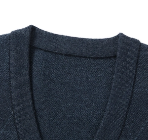 Detailed close-up of dark navy V-neck knitted cardigan vest with ribbed neckline texture