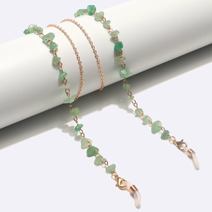 Detail of green aventurine stone eyeglass chain with gold metal link and non-slip rubber loop