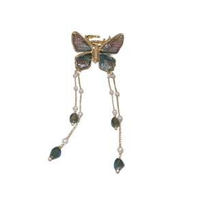 Elegant gold butterfly hair claw with iridescent wings and hanging pearl tassels