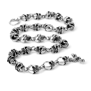 Punk style silver stainless steel skull link necklace with toggle clasp on white background
