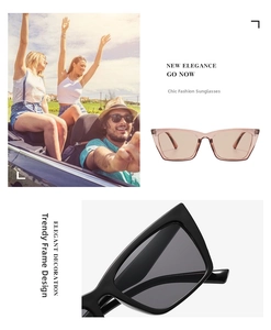 Detail shot of stylish cat eye sunglasses with pink translucent and black frames