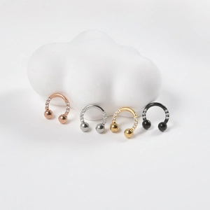 Set of four U-shaped horseshoe earrings in gold silver and black with cubic zirconia stones