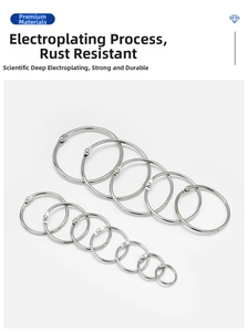 Various sizes of polished silver metal binder rings with hinged opening mechanism