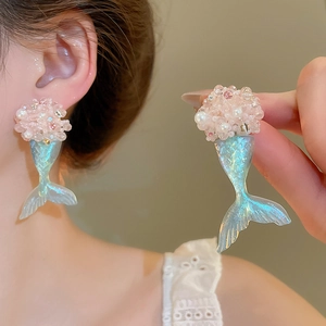 Detail of gradient blue mermaid tail earrings with pink bead flower cluster and pearls