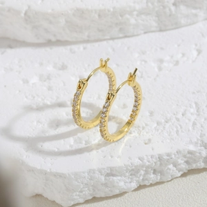 Detailed view of 14K gold-plated hoop earrings with micro-pave cubic zirconia stones