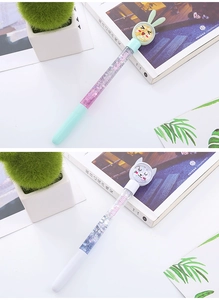 Detail of glitter liquid quicksand pens with cute bunny and cat cartoon toppers