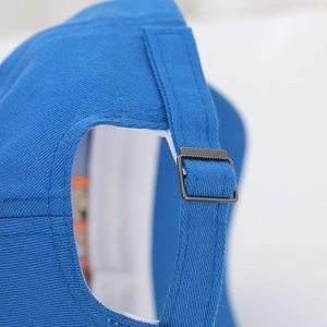 Close-up detail showing the adjustable metal buckle on blue baby baseball cap strap