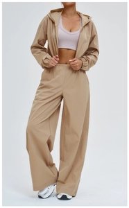 Detail of light khaki sun protection set with zip hoodie and high-waisted wide-leg pants