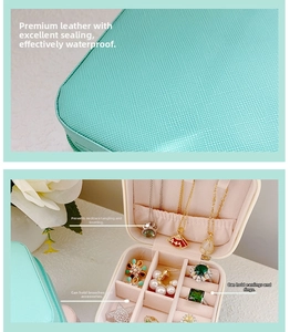 Waterproof leather travel jewelry box with zipper closure and necklace storage hooks