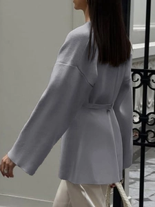 Elegant grey long-sleeved cardigan with waist belt shown from back view on a model