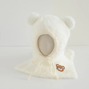 Detailed view of white faux mink hood with soft bear ears and brown bear embroidery
