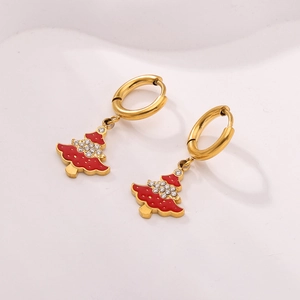 Detailed shot of gold hoop earrings with red enamel Christmas tree and cubic zirconia