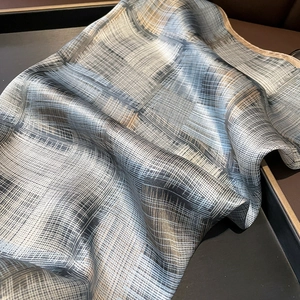 Elegant mulberry silk square scarf featuring blue and brown abstract striped patterns