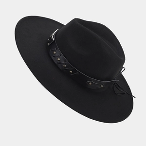 Detail of black wide brim fedora with leather band and vintage bronze rivets decor