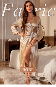 Detail of elegant champagne satin robe with silky texture and adjustable waist tie belt