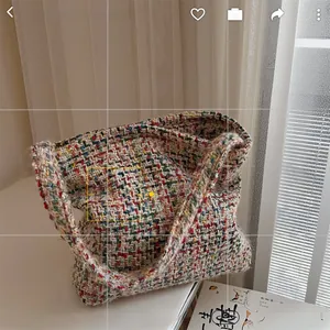 Macro shot of colorful tweed knit fabric texture on a stylish multi-color tote shoulder bag