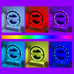 Detail view showing multiple RGB lighting modes and color gradients of the sand art lamp