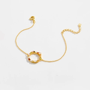 Detailed close-up of a S925 silver gold-plated bracelet with a colorful gemstone wreath