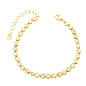 Detail of gold tennis bracelet with clear round-cut zircons and heart charm closure