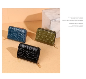 Three crocodile embossed zip card holders in black, dark green and navy blue colors