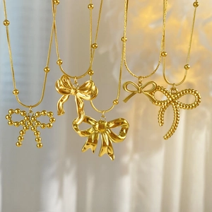 Elegant 18K gold plated titanium steel bow necklace with delicate bead and snake chains