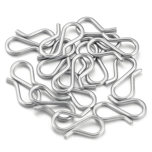 Close-up of bulk silver S-hook connectors for DIY jewelry making and bracelet assembly