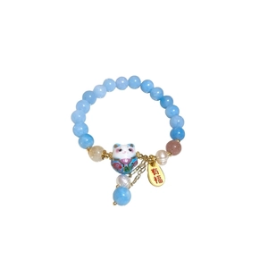 Sky blue beaded bracelet with white pearl, lucky cat charm and golden plaque