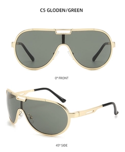 Close-up of aviator sunglasses with a gold metal frame and green lenses in C5 style