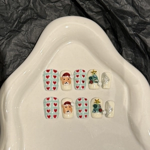Handmade Christmas deer press-on nails with green and red festive hand-painted art
