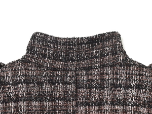 Macro shot of metallic thread tweed fabric and collar detail on a stylish bomber jacket