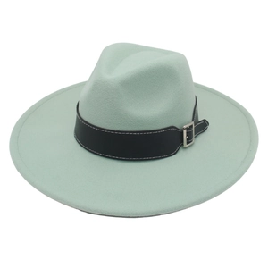 Detail of mint green fedora hat featuring a black faux leather band and silver buckle