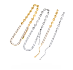 Detail of gold and silver pig nose chains with square zircon pavé setting and metal tags