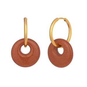 Detailed macro view of gold-tone hoop earrings with glittering red-brown goldstone charms