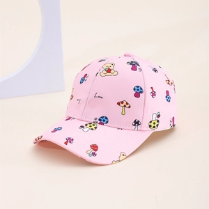 Detail of pink kids baseball cap featuring cute cartoon bear and mushroom print pattern