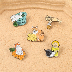 Detailed view of 5-piece cartoon cat enamel pins set featuring unique playful designs