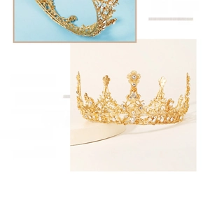Detail of golden bridal crown with intricate hollow flowers and sparkling rhinestones