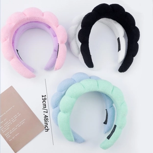 Thick padded sponge twist headbands in various colors for face washing and makeup