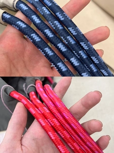 Close-up of pink and blue braided drawstrings showing high-quality woven texture