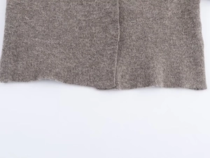 Close-up of knit texture and premium stitching on a brown grey wool blend pilot jacket