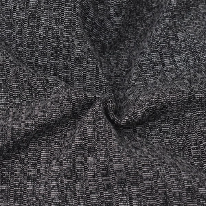 Macro shot of heather grey ribbed knit fabric texture with soft drapes and folds