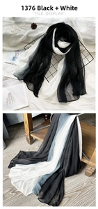 Detail of gradient silk scarf with pleat texture and natural drape in black and white