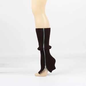 Detailed view of dark brown ribbed knit leg warmer with side zipper and triangle pendant