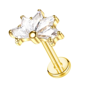 Detailed close-up of G23 titanium labret stud with gold butterfly zircon cluster