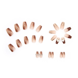 Caramel marble press-on nails with golden foil, white hearts and crystal chain accents