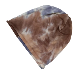 Close-up of soft knitted tie-dye beanie featuring brown, blue and cream textured fabric