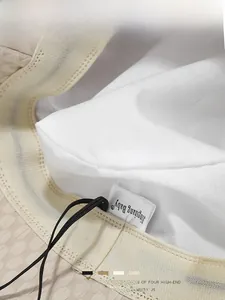 Detailed macro view of beige bucket hat interior with sweatband and adjustable drawstring